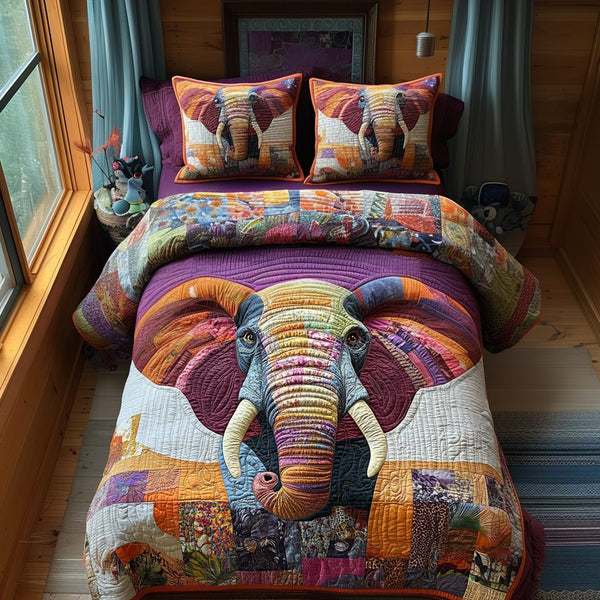 Elephant Harmony quilted 3-piece bedding set on a made bed with two matching pillow shams