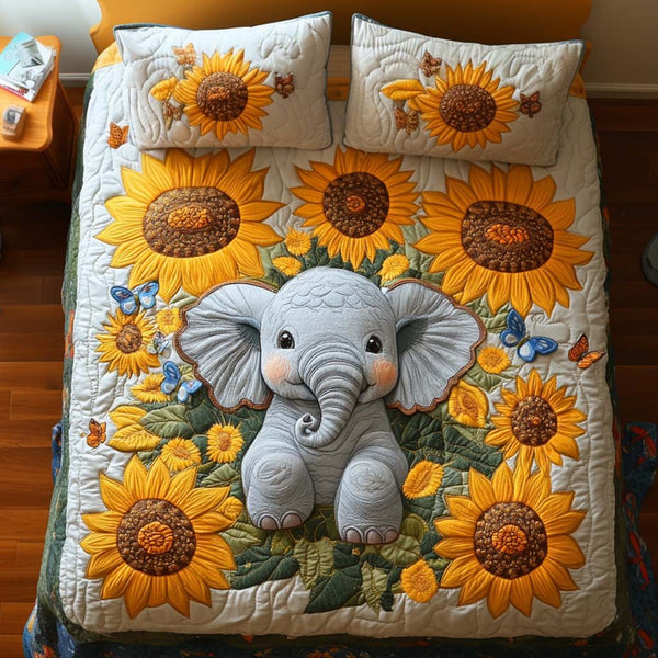 Elephant Harmony quilted 3-piece bedding set on a made bed with two matching pillow shams