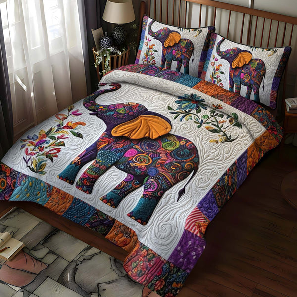 Elephant Jubilee quilted 3-piece bedding set on a made bed with two matching pillow shams