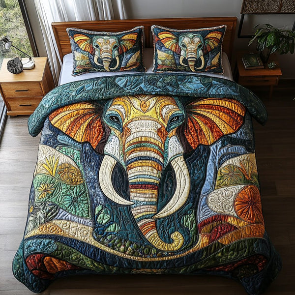 Elephant Odyssey quilted 3-piece bedding set on a made bed with two matching pillow shams