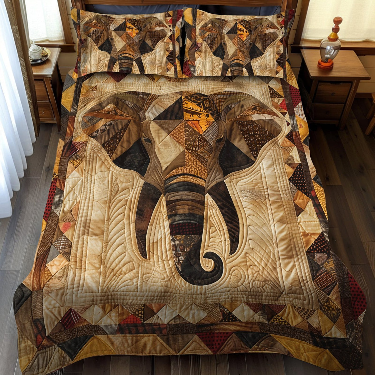Elephant quilted 3-piece bedding set on a made bed with two matching pillow shams