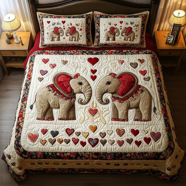 Elephant Romance quilted 3-piece bedding set on a made bed with two matching pillow shams