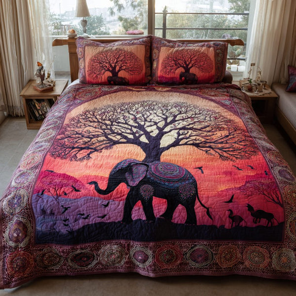 Elephant Spirit quilted 3-piece bedding set on a made bed with two matching pillow shams