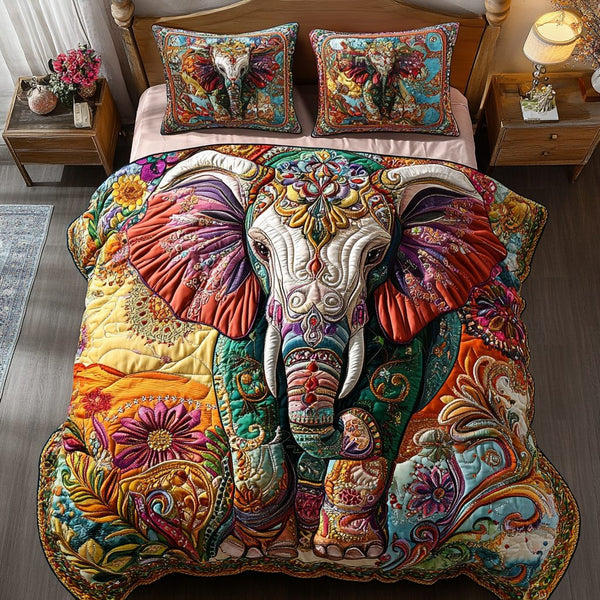 Elephant Spirit quilted 3-piece bedding set on a made bed with two matching pillow shams