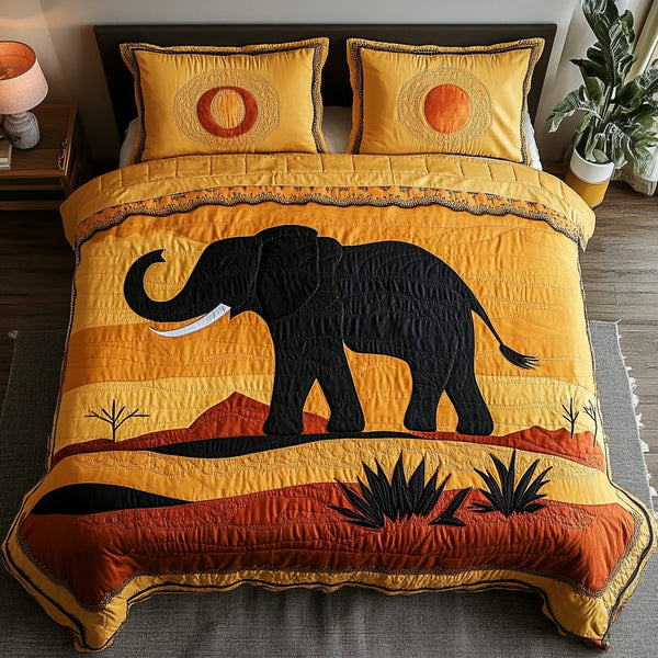 Elephant Whispers quilted 3-piece bedding set on a made bed with two matching pillow shams