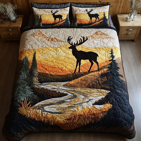 Elk Valley Dreams quilted 3-piece bedding set on a made bed with two matching pillow shams