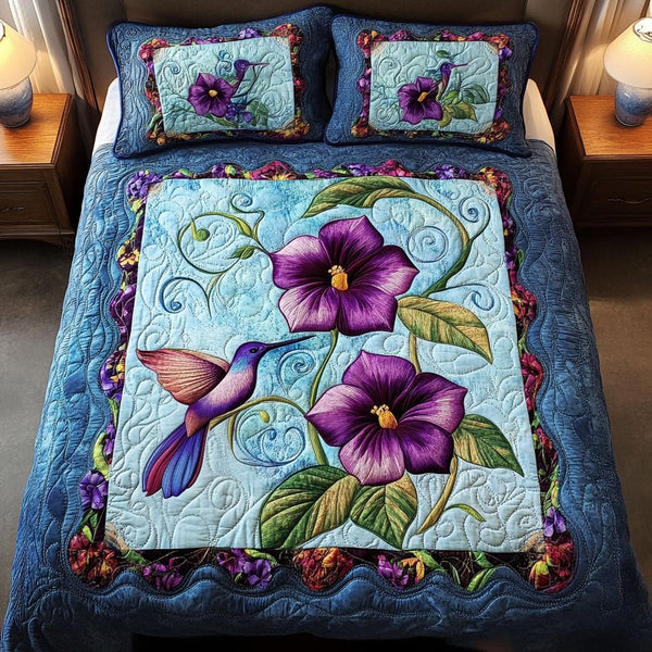 Emerald Breeze quilted 3-piece bedding set on a made bed with two matching pillow shams