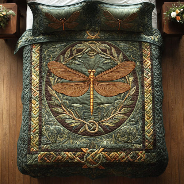 Emerald Dragonfly quilted 3-piece bedding set on a made bed with two matching pillow shams