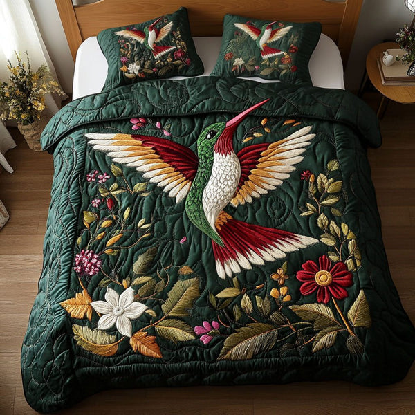 Emerald Elegance quilted 3-piece bedding set on a made bed with two matching pillow shams