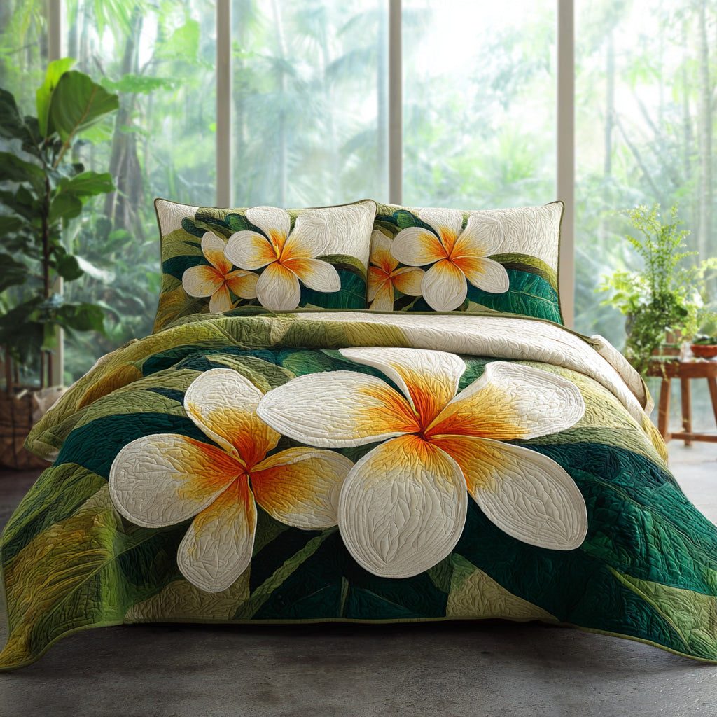 Emerald Frangipani quilted 3-piece bedding set on a made bed with two matching pillow shams