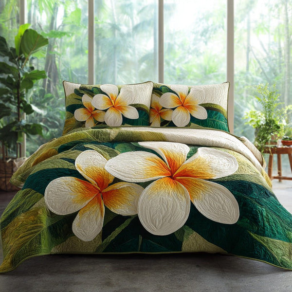Emerald Frangipani quilted 3-piece bedding set on a made bed with two matching pillow shams