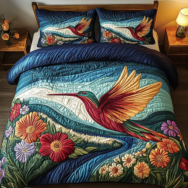 Emerald River Wings quilted 3-piece bedding set on a made bed with two matching pillow shams