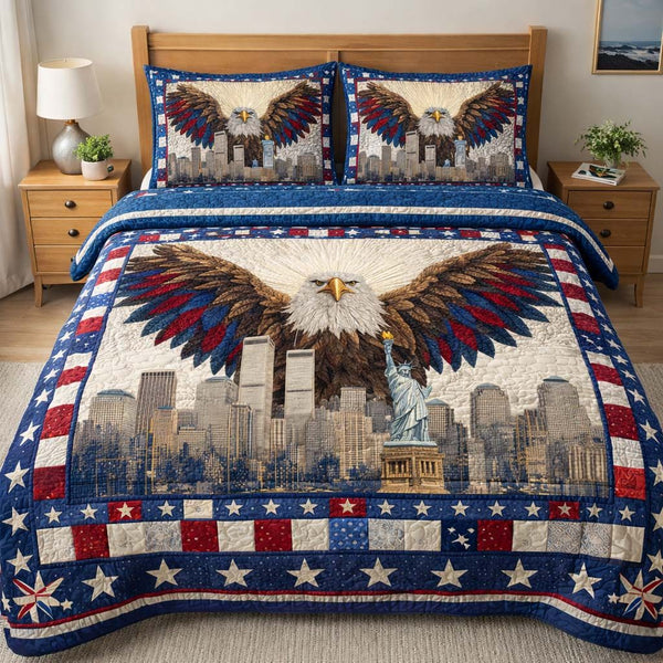 Empire Guardian quilted 3-piece bedding set on a made bed with two matching pillow shams