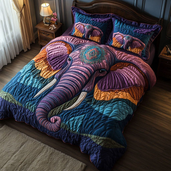 Enchanted Elephant Realm quilted 3-piece bedding set on a made bed with two matching pillow shams