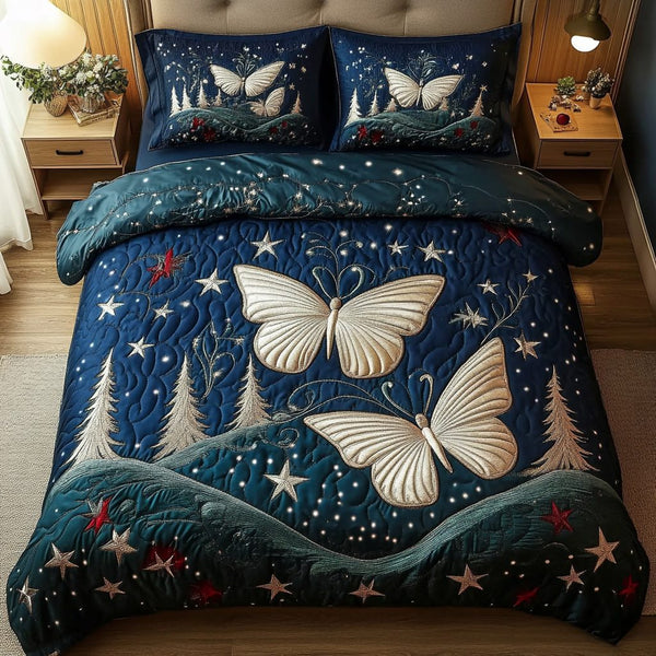 Enchanted Flight quilted 3-piece bedding set on a made bed with two matching pillow shams
