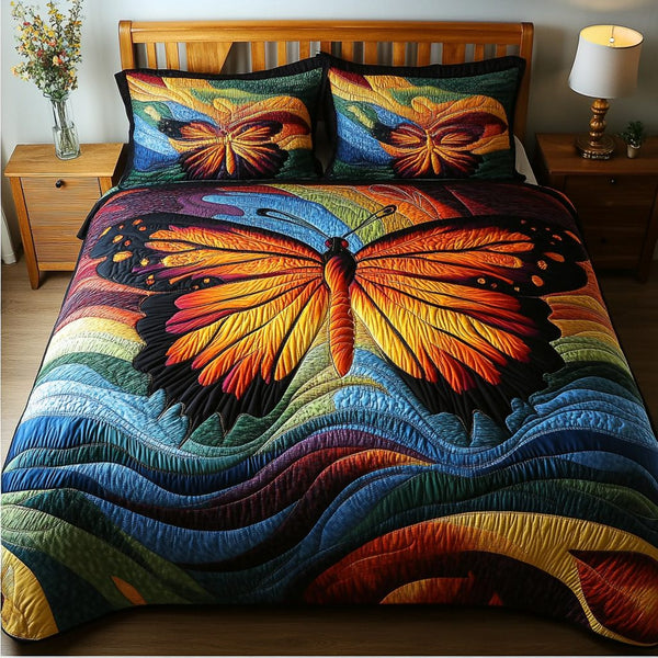 Enchanted Flutter quilted 3-piece bedding set on a made bed with two matching pillow shams