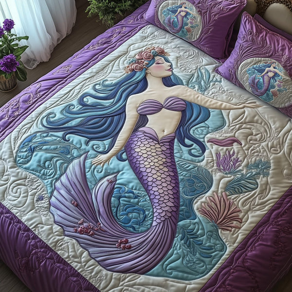 Enchanted Mermaid quilted 3-piece bedding set on a made bed in a light coastal bedroom