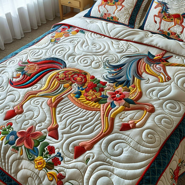 Enchanted Mirage quilted 3-piece bedding set on a made bed with two matching pillow shams