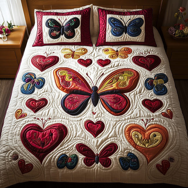 Enchanted Wings quilted 3-piece bedding set on a made bed with two matching pillow shams