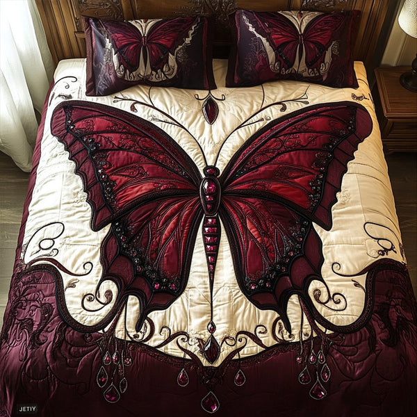 Enchanted Wings quilted 3-piece bedding set on a made bed with two matching pillow shams