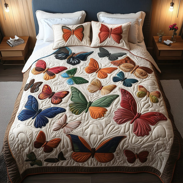 Enchanting Butterflies quilted 3-piece bedding set on a made bed with two matching pillow shams