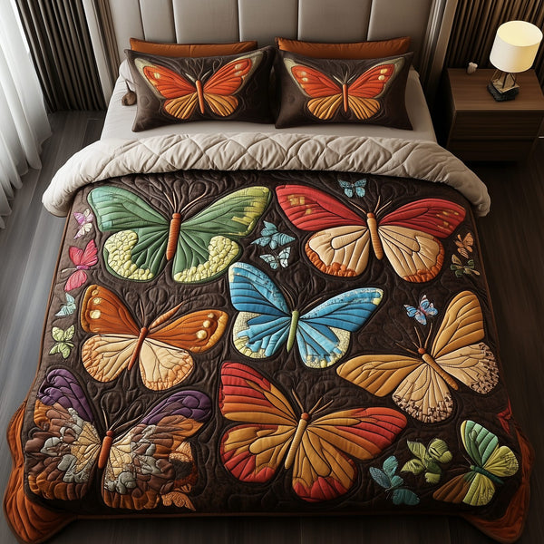 Enchanting Butterflies quilted 3-piece bedding set on a made bed with two matching pillow shams