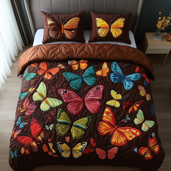 Enchanting Butterflies quilted 3-piece bedding set on a made bed with two matching pillow shams
