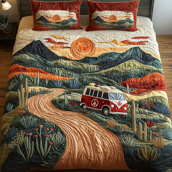 Endless Desert Roads quilted 3-piece bedding set on a made bed with two matching pillow shams