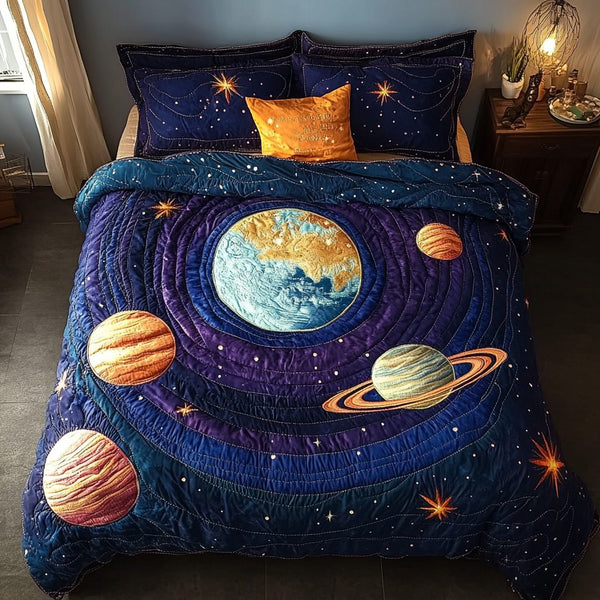 Eternal Orbit quilted 3-piece bedding set on a made bed with two matching pillow shams