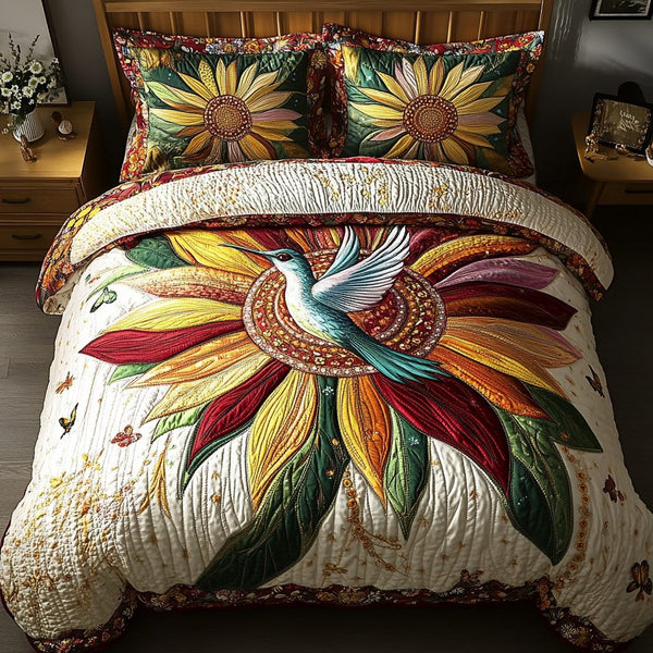 Ethereal Bloom Hummingbird quilted 3-piece bedding set on a made bed with two matching pillow shams