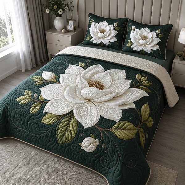 Ethereal Magnolia quilted 3-piece bedding set on a made bed with two matching pillow shams
