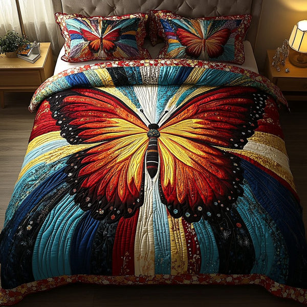 Ethereal Wings quilted 3-piece bedding set on a made bed with two matching pillow shams
