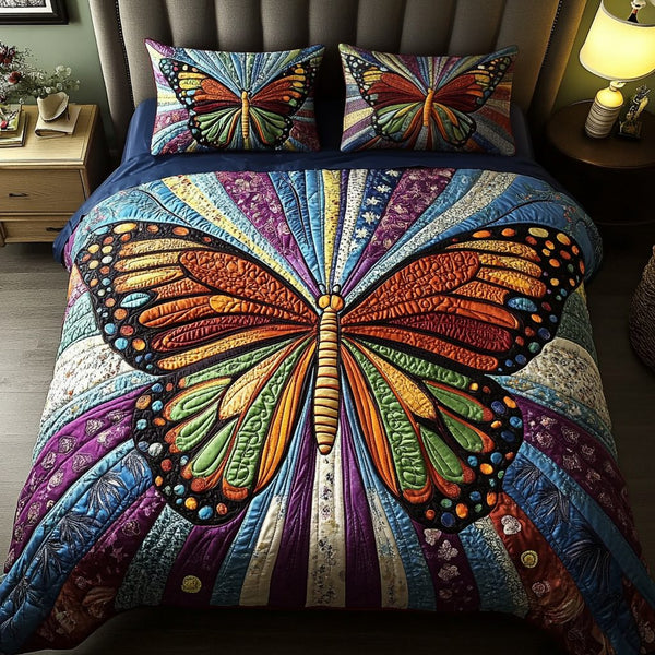 Ethereal Wings quilted 3-piece bedding set on a made bed with two matching pillow shams