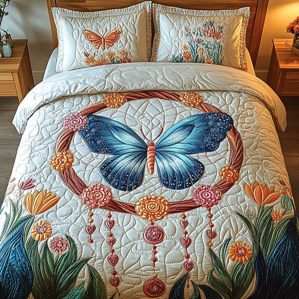 Ethereal Wings quilted 3-piece bedding set on a made bed with two matching pillow shams