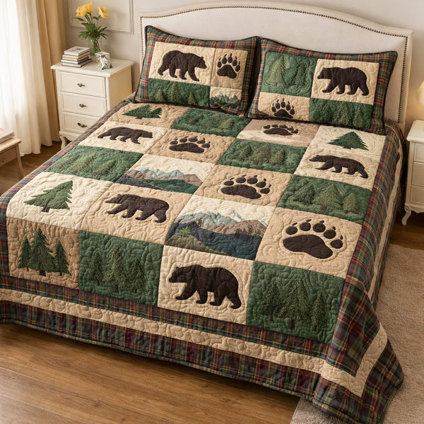 Evergreen Wilderness quilted 3-piece bedding set on a made bed with two matching pillow shams