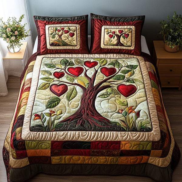 Everlasting Bloom quilted 3-piece bedding set on a made bed with two matching pillow shams