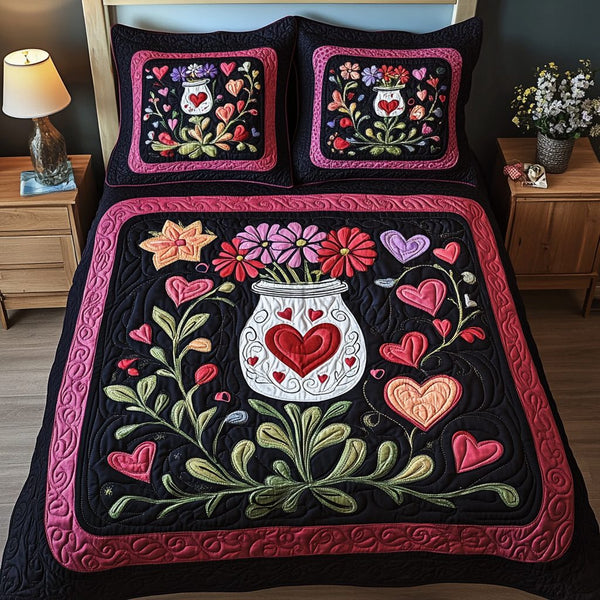 Everlasting Love quilted 3-piece bedding set on a made bed with two matching pillow shams