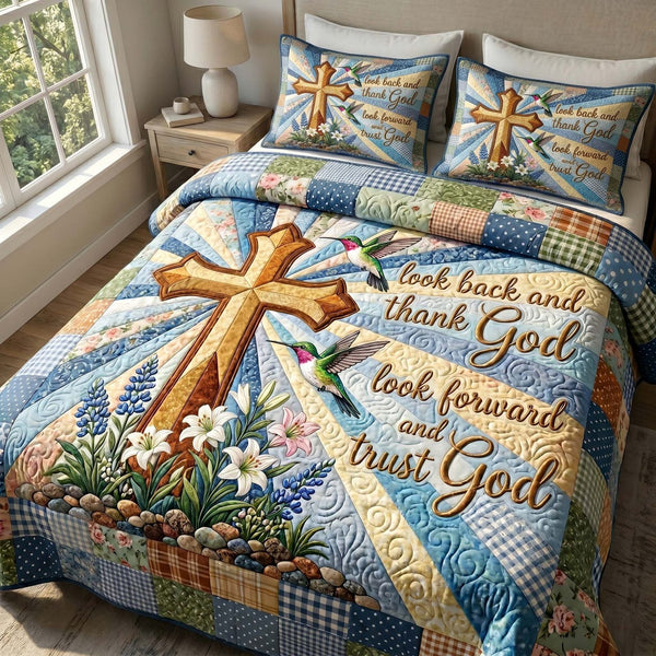 Faith Blossoms quilted 3-piece bedding set on a made bed in a softly lit bedroom