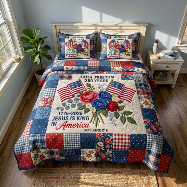 Faith Liberty quilted 3-piece bedding set on a made bed in a warmly lit bedroom