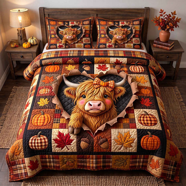 Fall Highland Cow quilted 3-piece bedding set on a made bed with two matching pillow shams