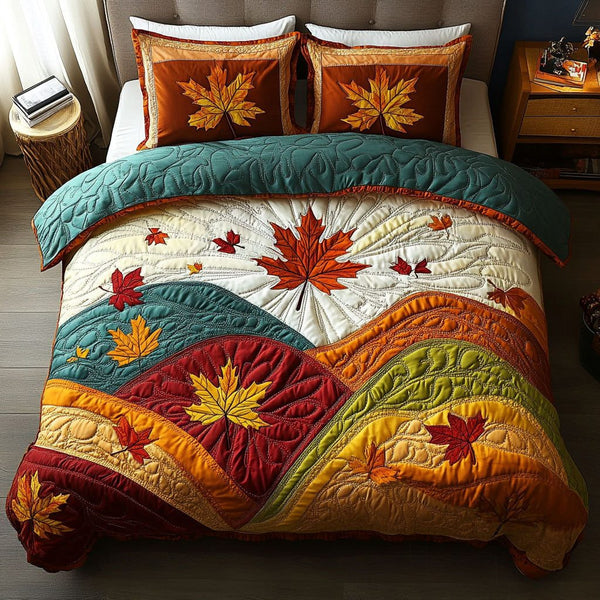 Fall Splendor quilted 3-piece bedding set on a made bed with two matching pillow shams
