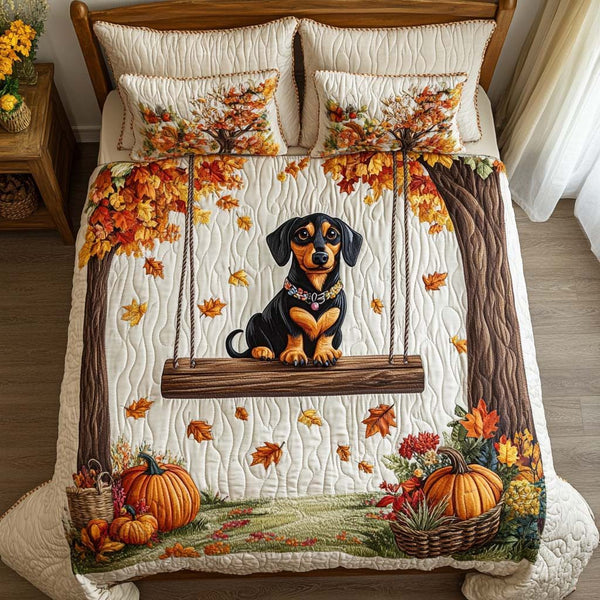 Falling for Doxie quilted 3-piece bedding set on a made bed with two matching pillow shams