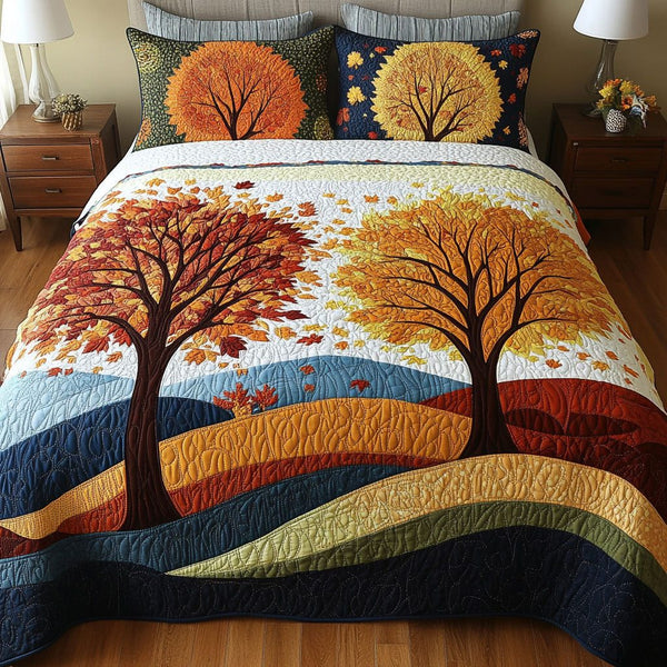 Falling Leaves quilted 3-piece bedding set on a made bed with two matching pillow shams