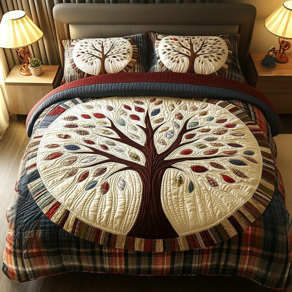 Family Tree quilted 3-piece bedding set on a made bed with two matching pillow shams