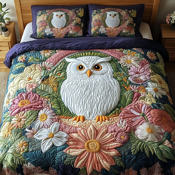Feather Bloom quilted 3-piece bedding set on a made bed with two matching pillow shams