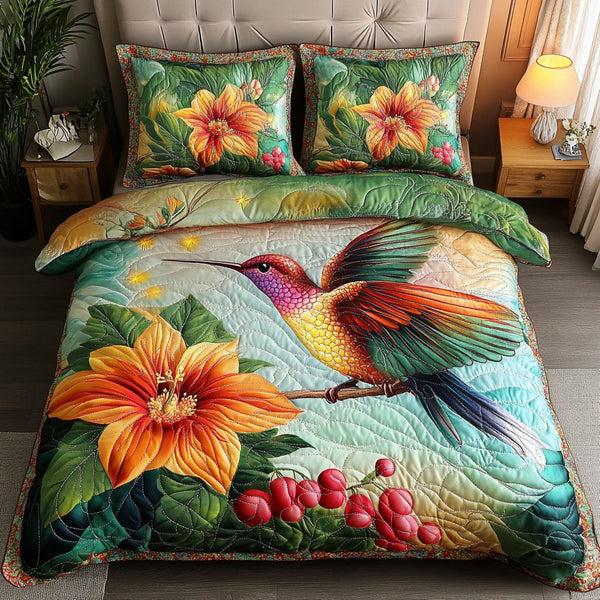 Feathered Bliss quilted 3-piece bedding set on a made bed with two matching pillow shams