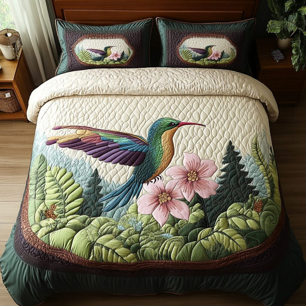 Feathered Charm quilted 3-piece bedding set on a made bed with two matching pillow shams