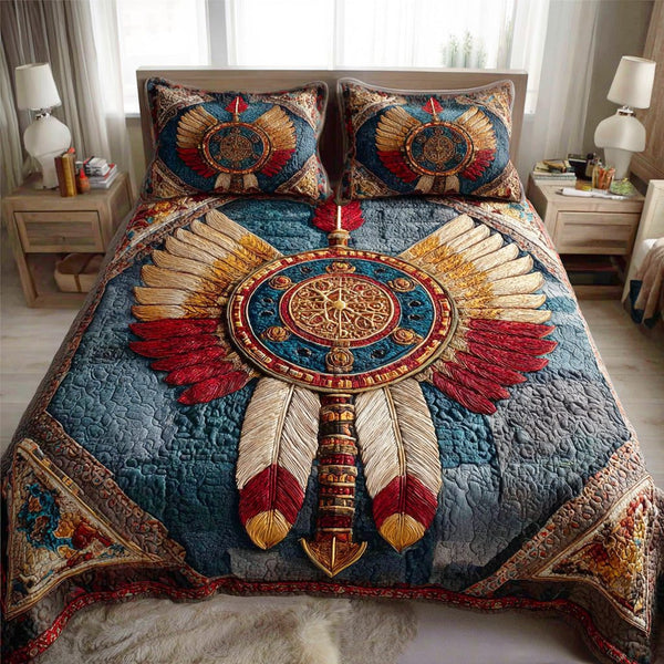 Feathered Dream quilted 3-piece bedding set on a made bed with two matching pillow shams