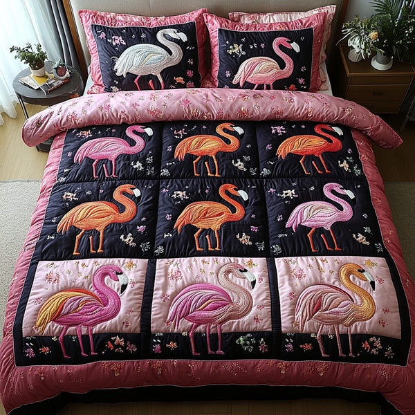 Feathered Dreams quilted 3-piece bedding set on a made bed with two matching pillow shams