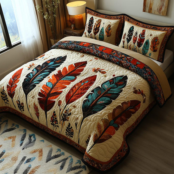 Feathered Dreams quilted 3-piece bedding set on a made bed with two matching pillow shams